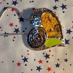 Heart shaped silver pendant on silver chain